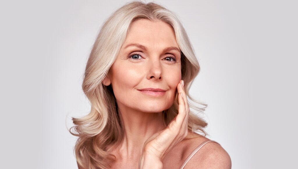 Older female model with smooth facial skin