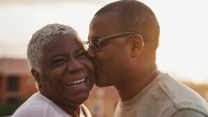 Older Son Giving Mother Kiss on the Cheek