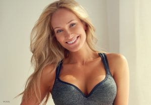 Smiling Caucasian Model in Gray Sports Bra