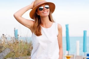 Middle Aged Female Wearing Sunhat and Aviator Glasses