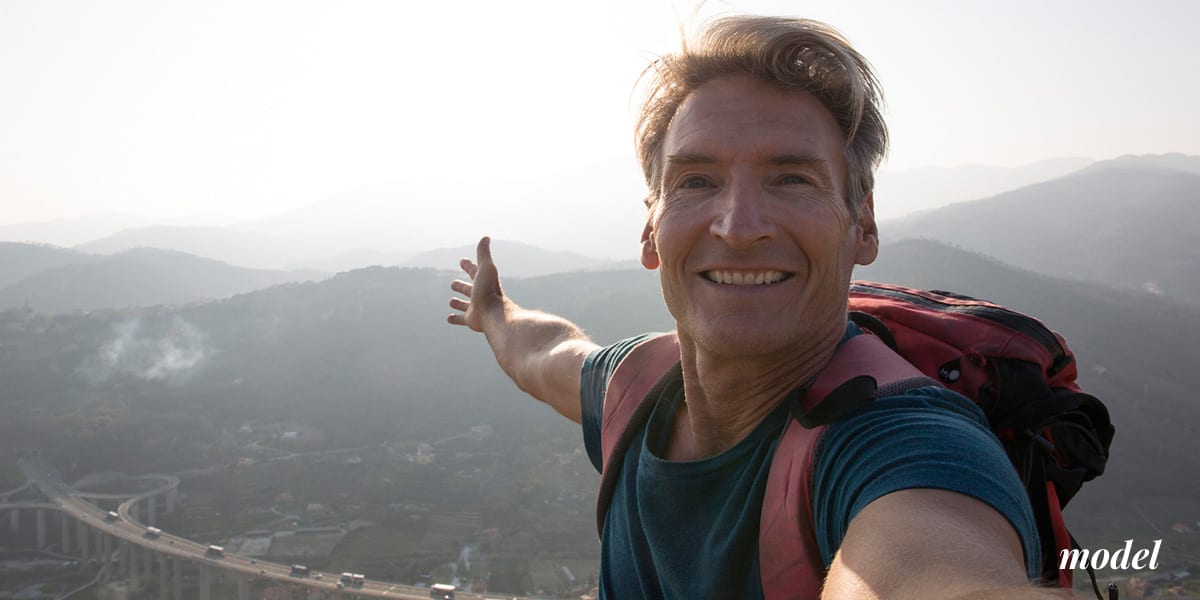 Middle Aged Man Hiking and Taking a Selfie